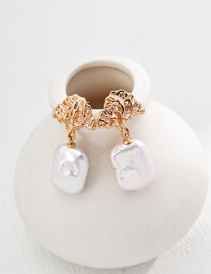 Baroque pearl earrings with detailed gold leaf designs, crafted for women seeking timeless and unique jewelry pieces